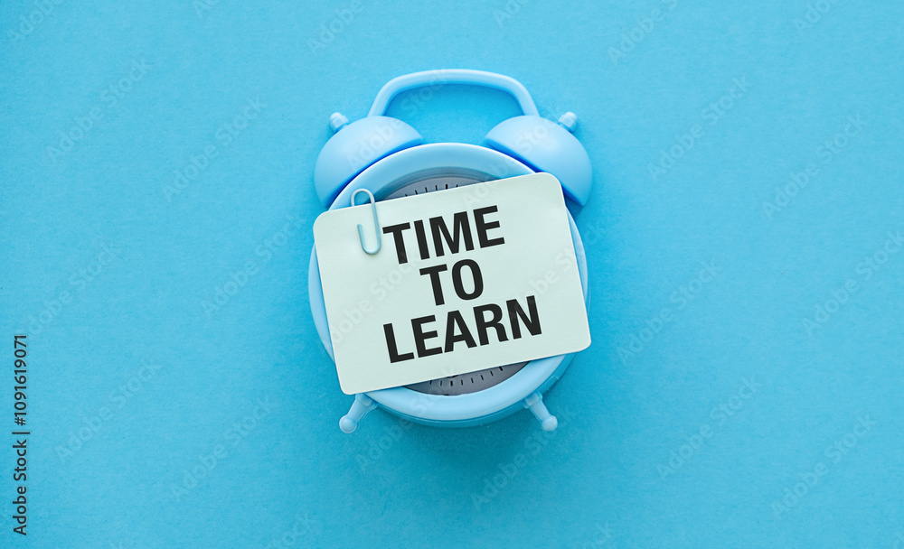Aufkleber blu alarm clock with text time to learn on blue background