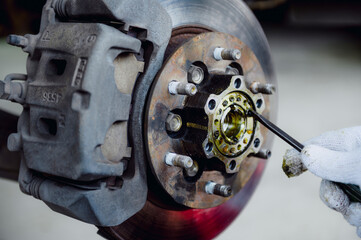 Change front wheel bearing grease.