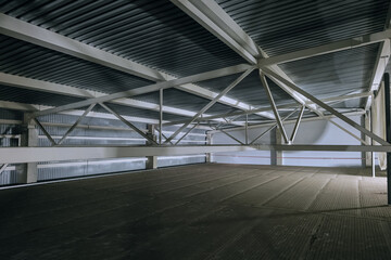 Attic space. Metal trusses covering an industrial building.