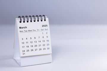 March 2025 calendar - month page on white desk