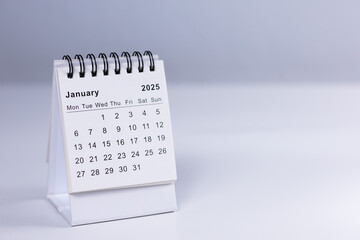 January 2025 calendar - month page on white desk