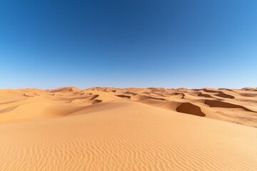 Ahead road crossing a vast desert with sand dunes stretching endlessly on both sides