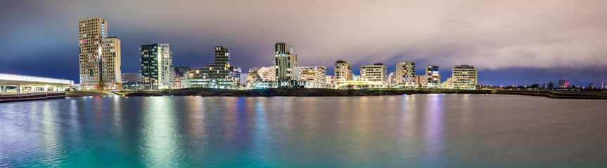 Fototapeta premium Vienna, Austria - December 27, 2022. New modern hipster quarter Asperner See Seestadt in Winter night