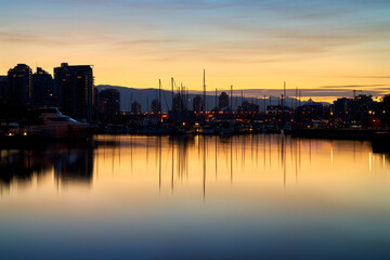 Fototapeta premium Yaletown Marina Twilight Sunrise Vancouver. Sunrise behind a marina in False Creek. Vancouver, British Columbia, Canada.