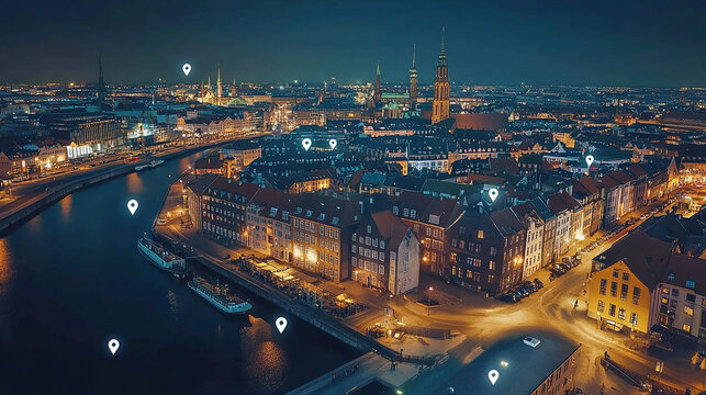 Aerial view of the Copenhagen skyline at night, with white pins on it representing buildings and shops that can be tiled to form a map for digital marketing, location pin icons floating