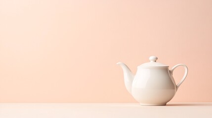 White Teapot on Soft Peach Background