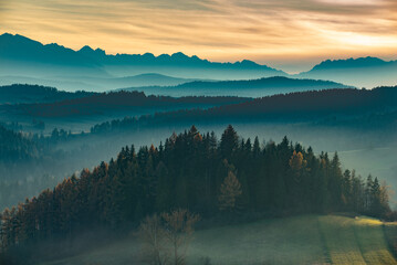 misty mountain ranges in the sunset light