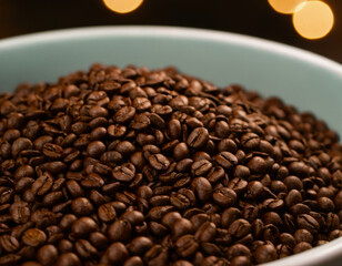 Fototapeta premium A detailed close-up of freshly roasted coffee beans in a bowl. The rich, brown tones highlight their texture and aroma, evoking warmth and comfort