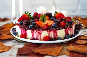 Traditional Christmas red fruit cheesecake with creative and luxurious decoration