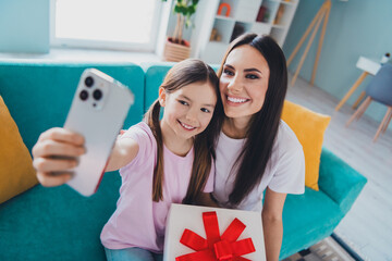 Photo of happy family lovely cute mom with daughter celebrate mother day take selfie indoors