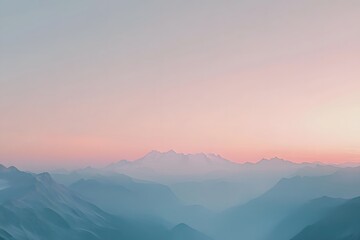 Fototapeta premium Pastel sunrise over misty mountain range, creating a serene and tranquil landscape.