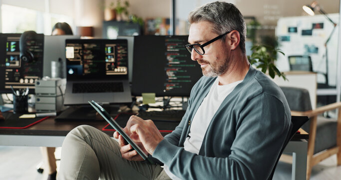 Code, business man and engineer on tablet for software development, scroll or update database. Programmer, digital technology or mature manager design game, website or app in creative startup office