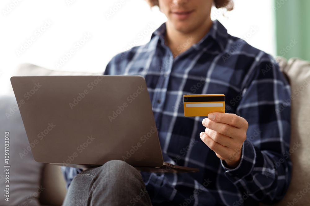 Poster online shopping. unrecognizable guy using laptop and credit card purchasing and paying in internet s