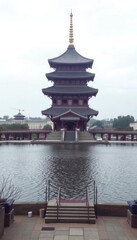 Obraz premium a large pagoda in the middle of a lake