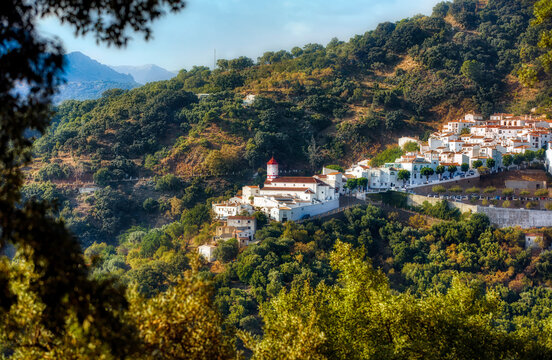 The Beautiful White Village of Genalguacil in the Malaga Province in Andalusia, Spain, with the Church of San Pedro de Verona
