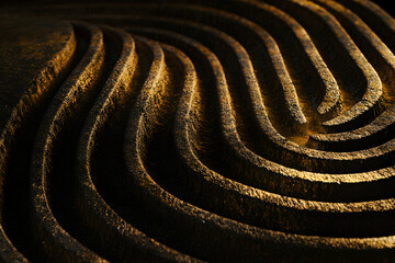 Naklejka premium Abstract golden textured background. Intricate curved lines create a luxurious, elegant design. Perfect for branding or website design.
