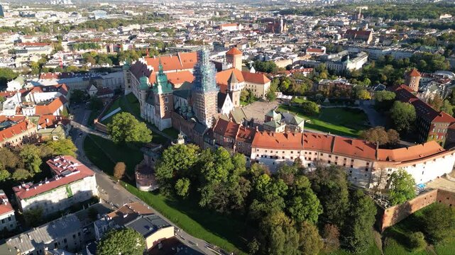 High angle shot of Wawel Royal Castle in Krakow, Poland. Footage oof Zamek Kr&oacute;lewski na Wawelu in Cracow seen from the air. Classical Crowning place of all Polish kings. Cityscape during sunrise.
