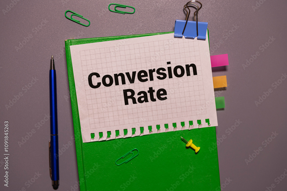 Poster there is a notebook with the word conversion rate. it is eye-catching image.