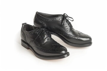 Quality black leather dress shoes made with classic brogue design suitable for formal occasions and professional settings