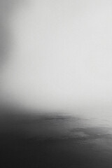 Fototapeta premium Abstract blurry grainy black and white gradient background. Dark grain and noise vertical template for textures, backdrops and wallpapers and overlays with copyspace