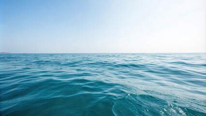 Obraz premium Softly gradient blue hues merge with gentle water ripples in the calm ocean surface, serene, peaceful, water texture
