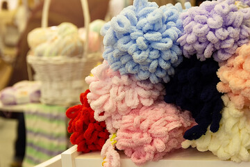 Colors wool balls on shop display stand for sale