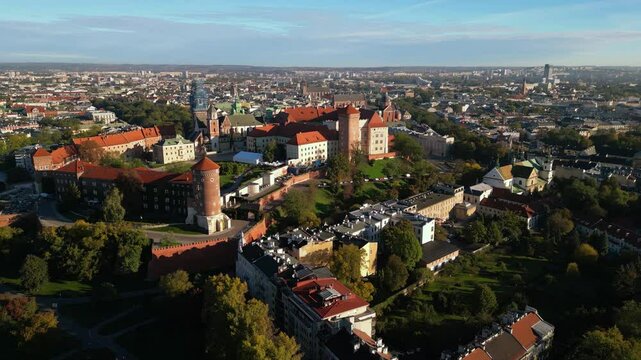 High angle shot of Wawel Royal Castle in Krakow, Poland. Footage oof Zamek Kr&oacute;lewski na Wawelu in Cracow seen from the air. Classical Crowning place of all Polish kings. Cityscape during sunrise.
