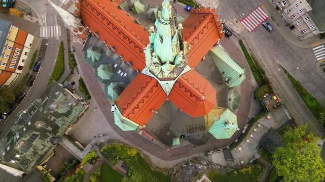 Aerial high angle top down footage oof St. Joseph's Church in Krakow, Poland. Sanktuarium Świętego J&oacute;zefa  Krakowie shot from the air. Sunrise around the autumn trees of polish city.  Close up.
