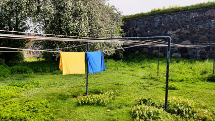 Two towels in the colors of Ukraine on a clothesline