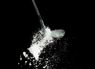 Golf Ball golfer hit snow to explode and splatter. Sand wedge golf dick ball from snow field and...