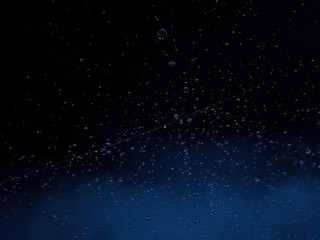 Obraz premium A delicate web of water droplets spreads across the darkened window, like a fragile tapestry, mesh, night