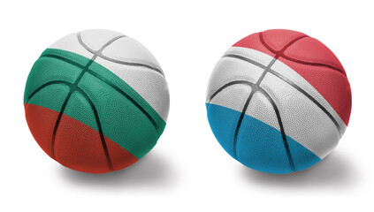basketball balls with the national flags of luxembourg and bulgaria on the white background.
