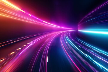 Fototapeta premium Colorful light trails flow along a curved roadway, illuminating the scene with vivid hues of pink, blue, and orange against a dark urban backdrop at night.