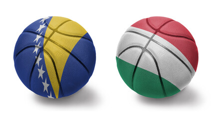 basketball balls with the national flags of hungary and bosnia and herzegovina on the white...