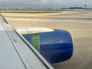 Jet Engine On The Runway With The Thrust Reverser Engaged