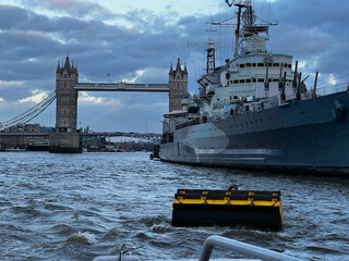 London, England, United Kingdom - October 2024: HMS Belfast and Tower Bridge on the River Thames.