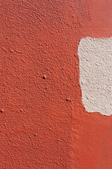 Fototapeta premium Red surface wall texture for vertical background, used painted wall