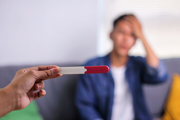 Frustrated Man Looking in Pregnancy While Sitting 