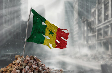 Dirty and torn Senegal flag, symbol of resistance and victory. A scene of war and devastation, the ruins of a city destroyed by conflicts. 3D Rendering.