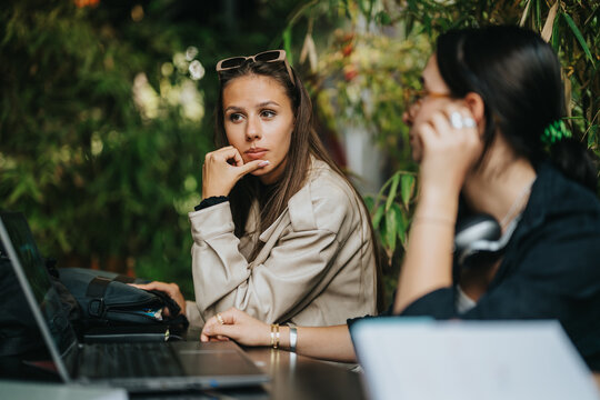 High school friends are studying together in a cozy coffee bar, sharing ideas and working on assignments collaboratively. The setting is relaxed, fostering engagement and creativity in a casual