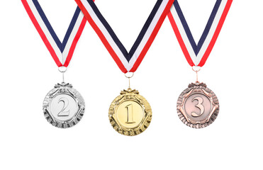 Gold, silver and bronze medals isolated on white