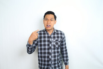Fototapeta premium angry asian man pointing finger to him self with crazy face wear casual shirt isolated on white