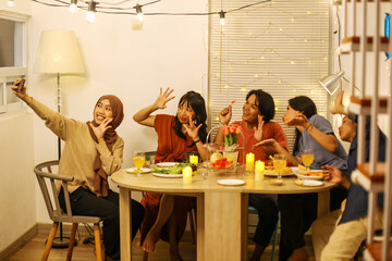 Friends Taking a Selfie at Dinner Celebration Together