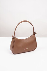 Women's luxury handbag, brown handbag purse, leather bag isolated on white background