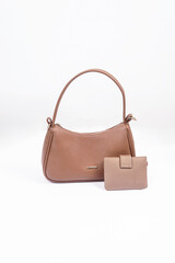 Women's brown handbag and wallet isolated on white background
