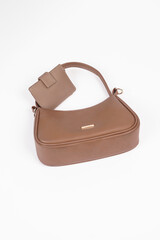 Women's brown handbag and wallet isolated on white background