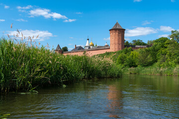 Fototapeta premium View of the Spaso-Evfimiev Monastery (a monastery of the Vladimir Diocese of the Russian Orthodox Church) on the bank of the Kamenka River on a sunny summer day, Suzdal, Vladimir region, Russia