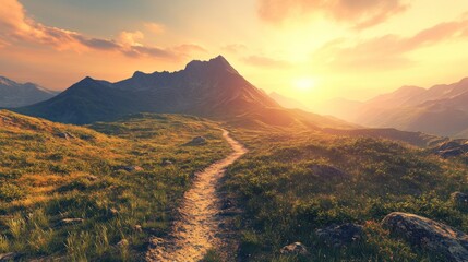 A winding dirt path leads through a grassy field towards a majestic mountain range at sunset. The sky is ablaze with orange and yellow hues, casting a warm glow over the landscape.