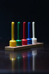 an abacus on a dark table
