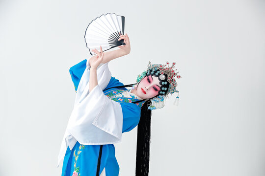 Beautiful Asian woman in traditional Yue opera costume on white background